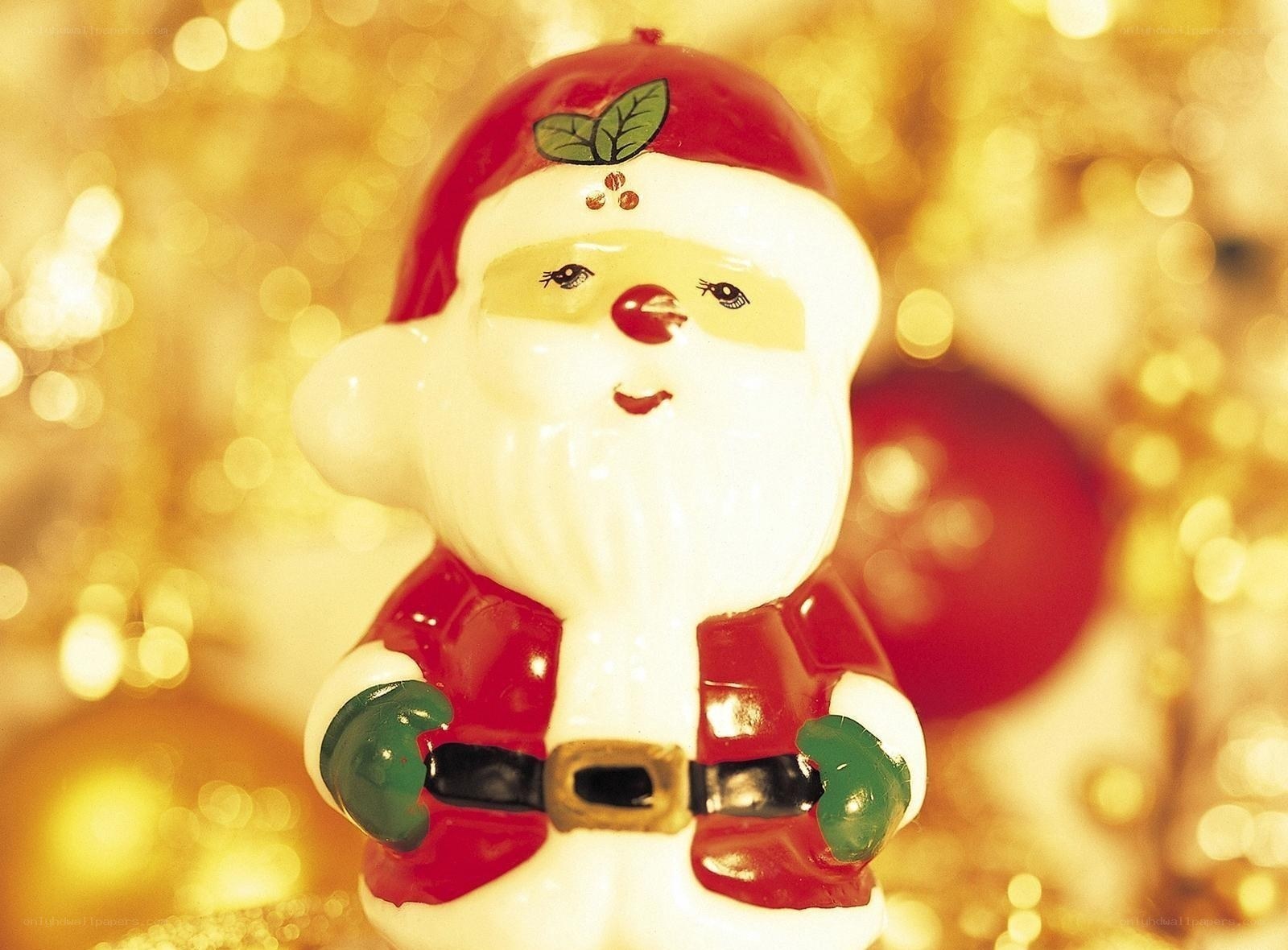 Santa Claus figurine with holly
