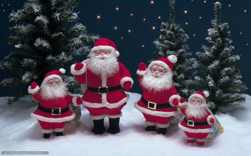 Santa Claus figurines in snow