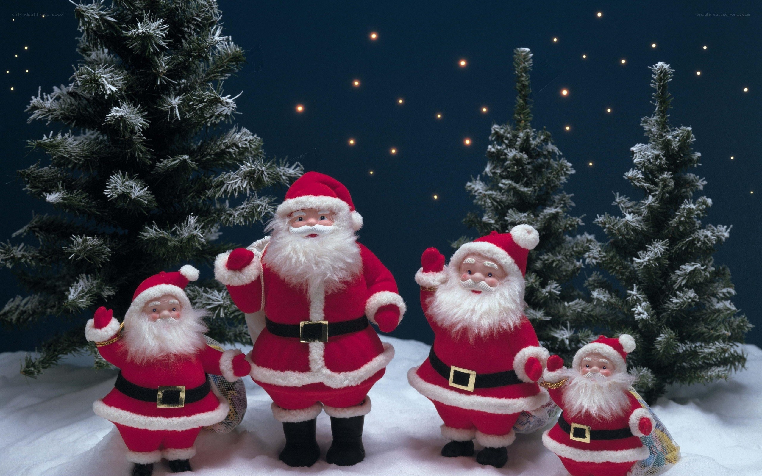 Santa Claus figurines in winter scene