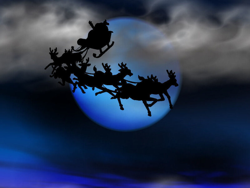 Santa Claus flying with reindeer