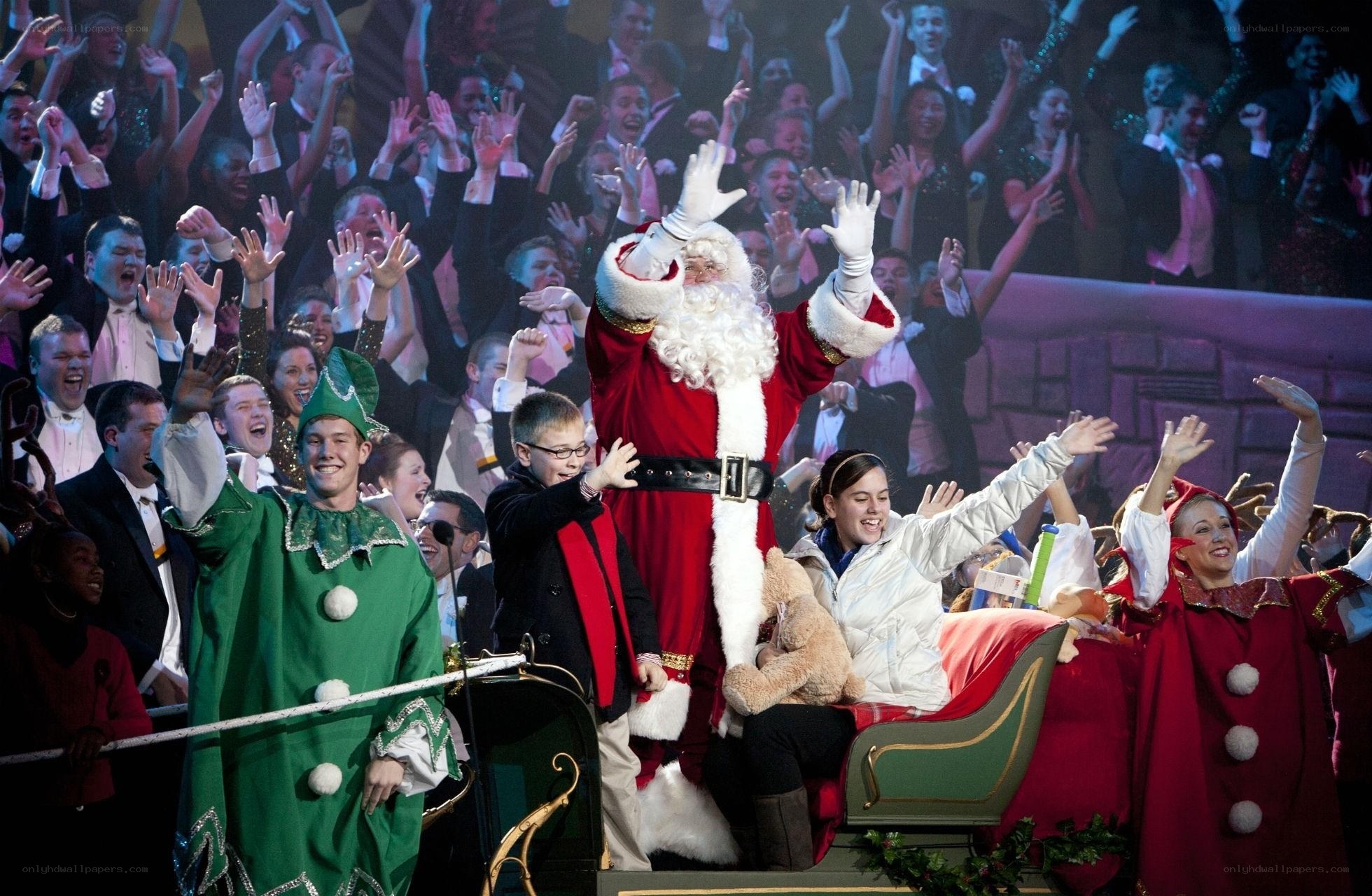 Santa Claus on stage with performers