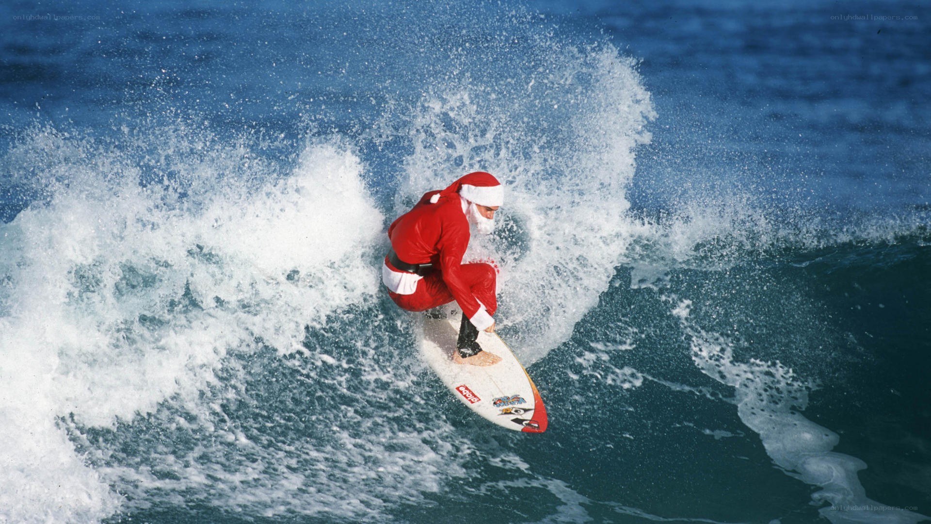 Santa Claus surfing a wave
