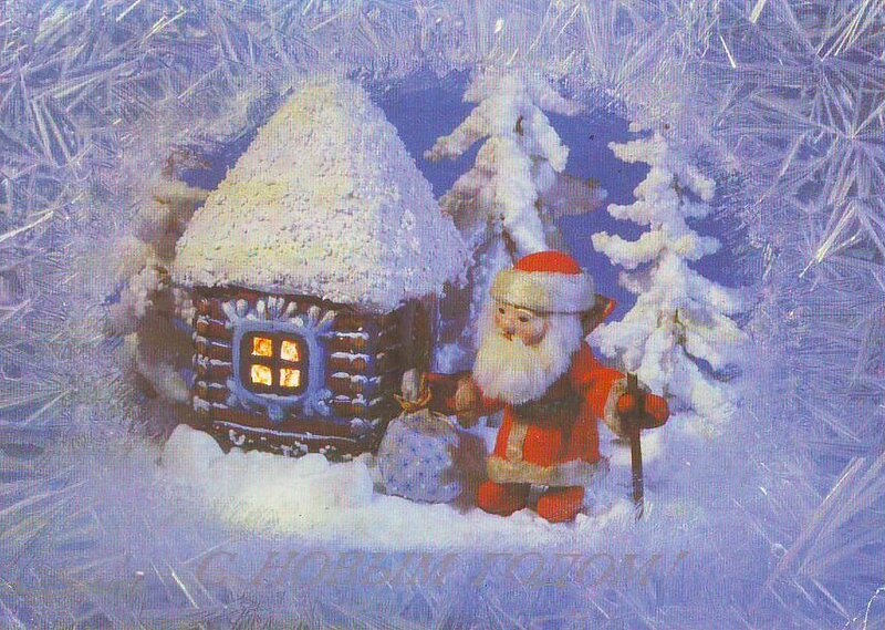 Santa Claus with a snow-covered house