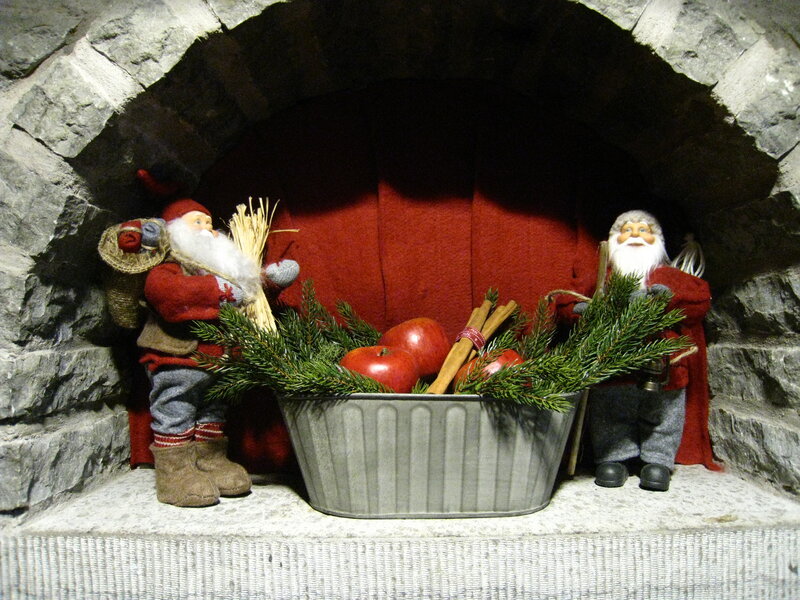 Santa Figurines in Fireplace