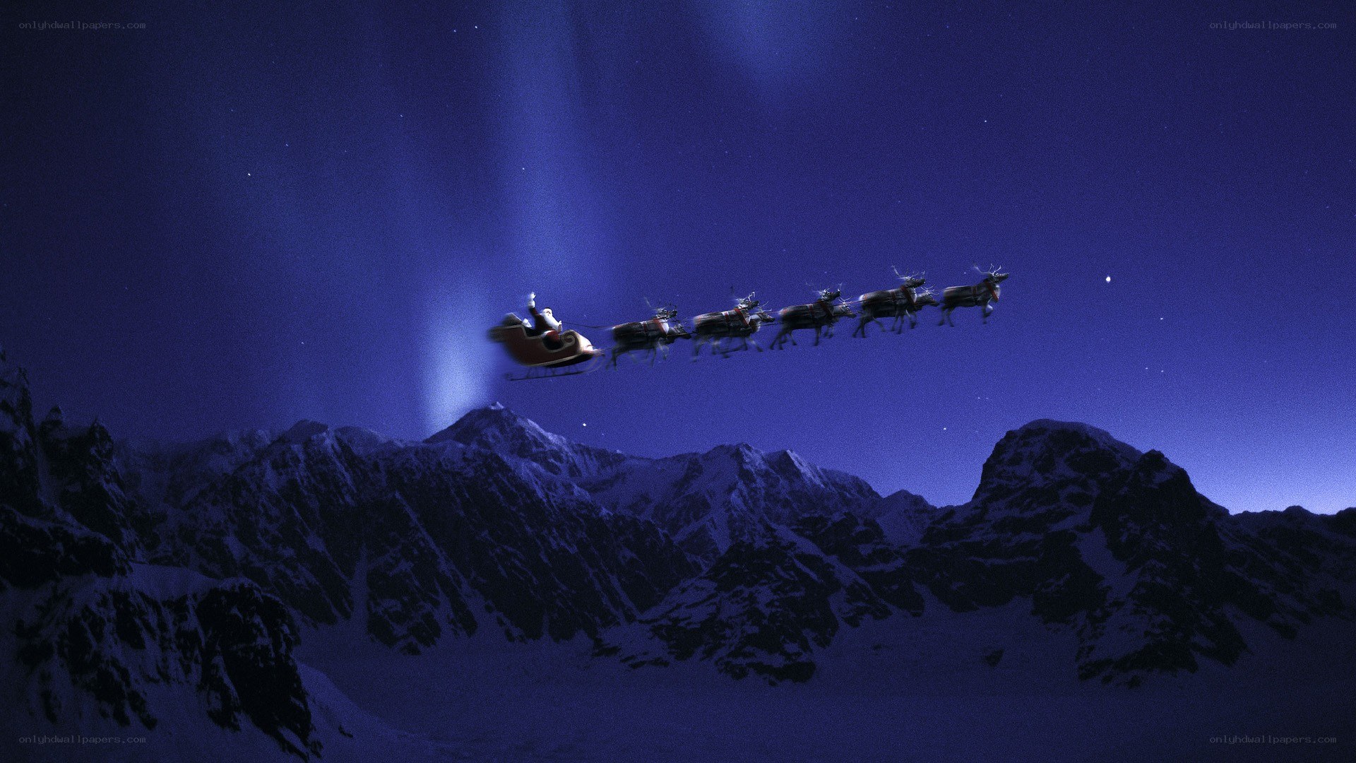 Santa flying over mountains