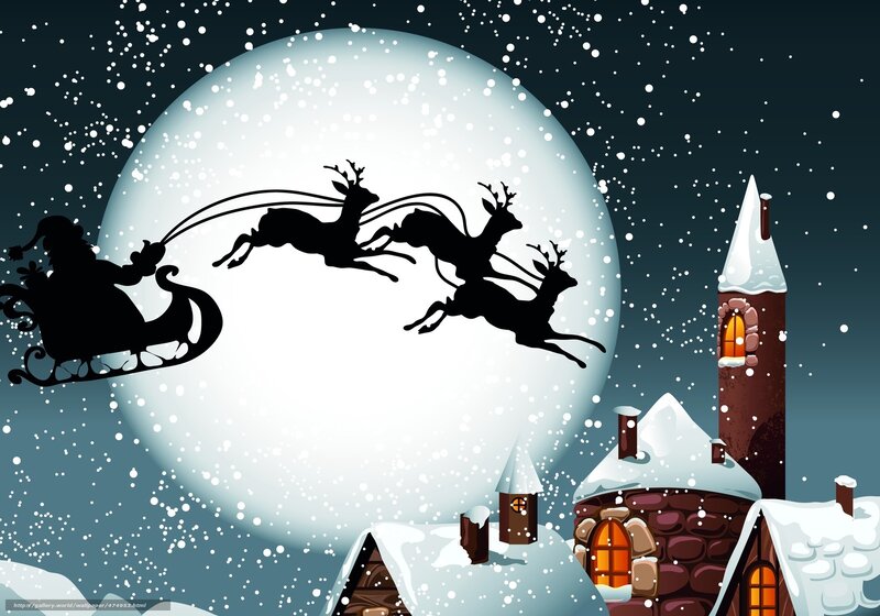 Santa flying over snowy village