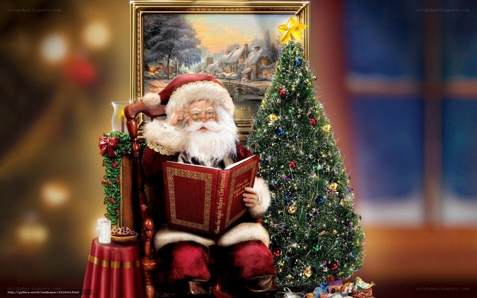 Santa reading by Christmas tree