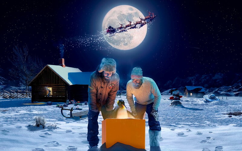 Santa's sleigh flies over snowy village