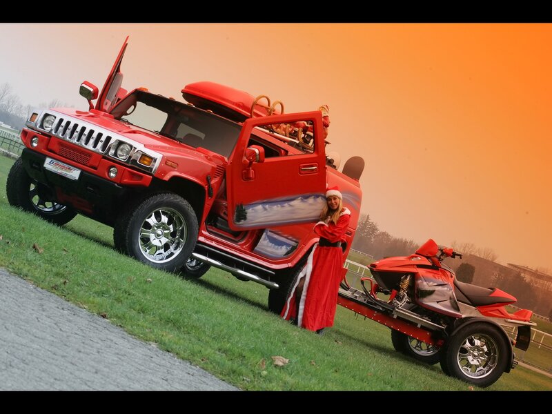 Santa with red Hummer and snowmobile
