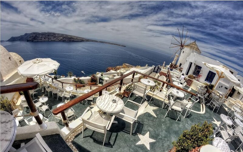 Santorini cafe with windmill