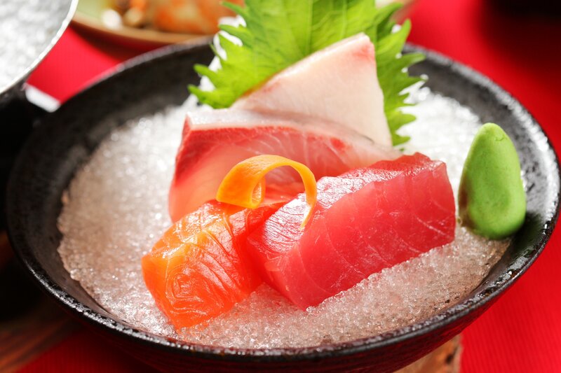 sashimi on ice with garnish