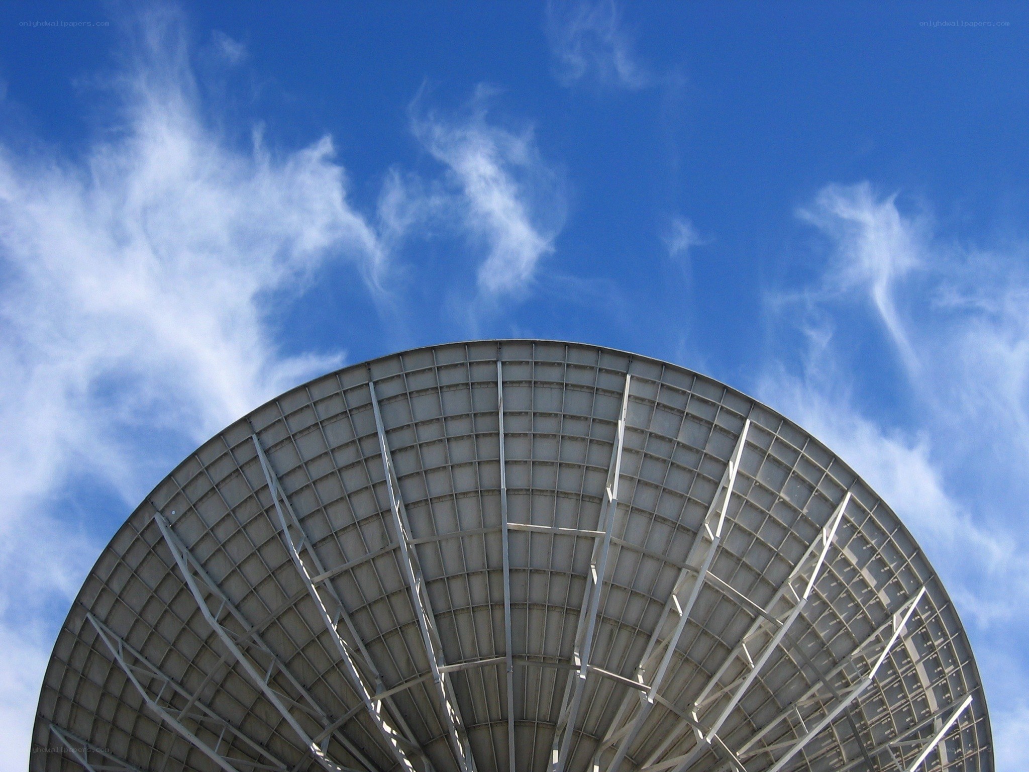 Satellite dish against blue sky