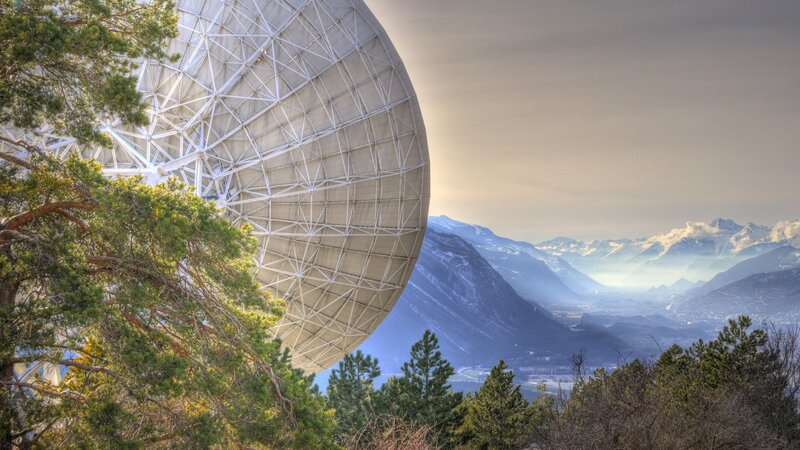 Satellite dish in mountain landscape