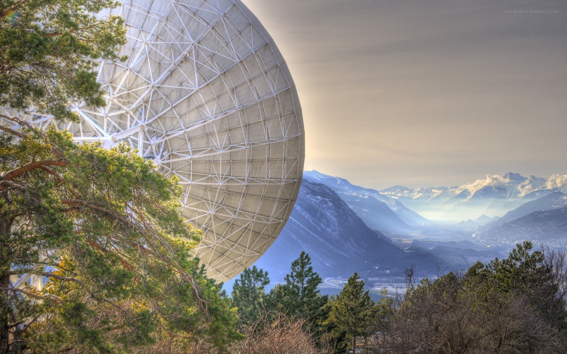 Satellite dish in mountain valley
