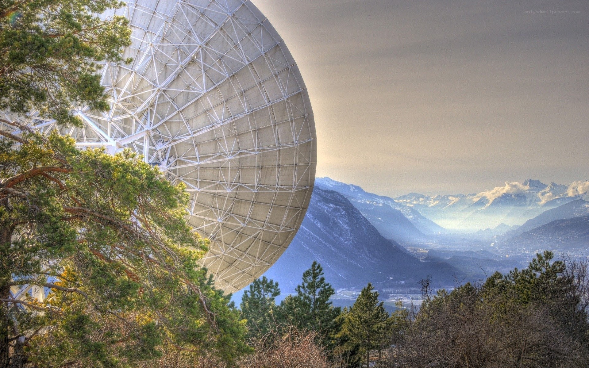 Satellite dish in mountain valley