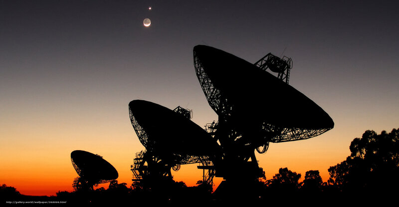 Satellite dishes at dusk