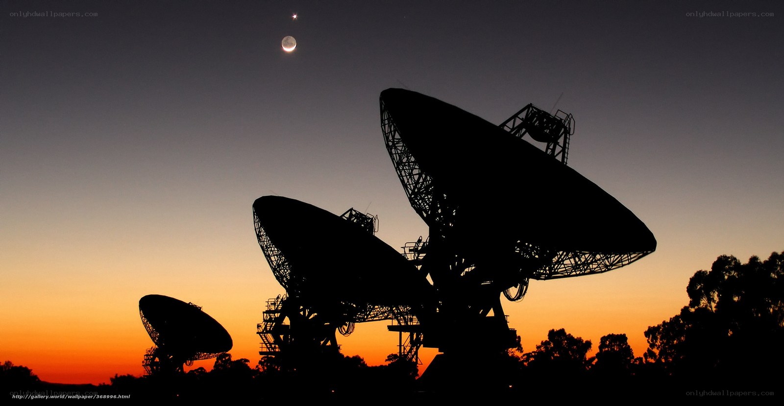 Satellite dishes at dusk