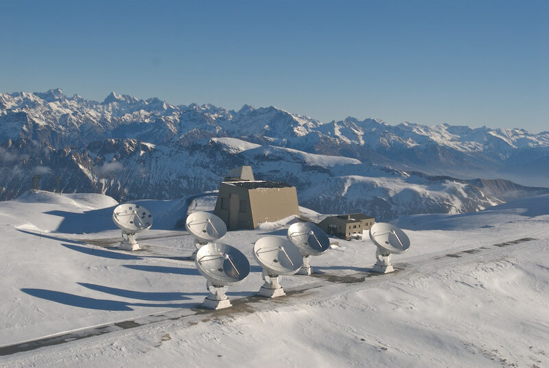 Satellite dishes on a snowy mountain