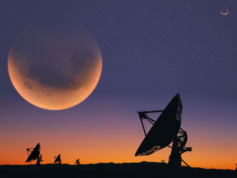 Satellite dishes under alien sky