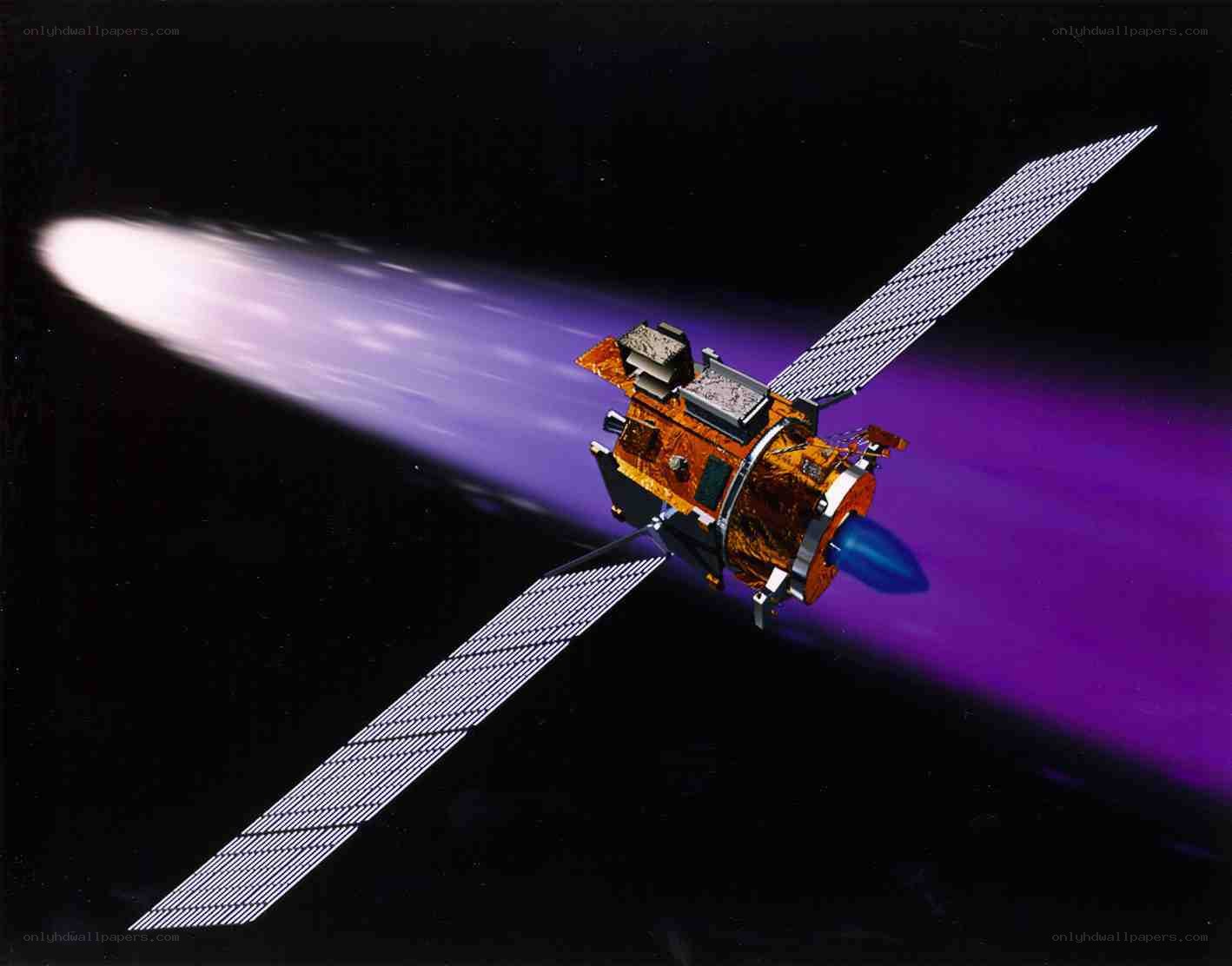 Satellite in space with engine firing