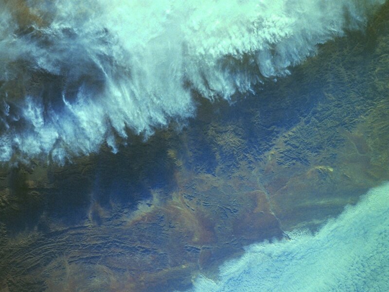 Satellite view of clouds and land