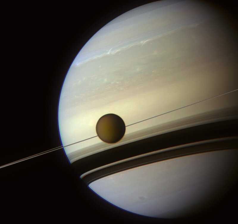 Saturn and Its Moon — White