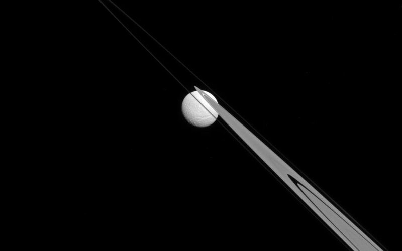 Saturn's Moon Enceladus — Black, Dramatic