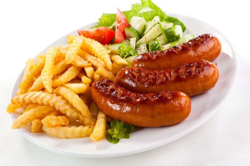 sausages with fries and salad