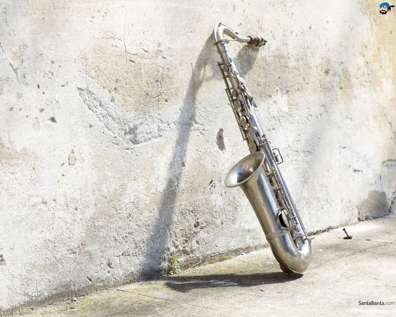 Saxophone leaning against a wall
