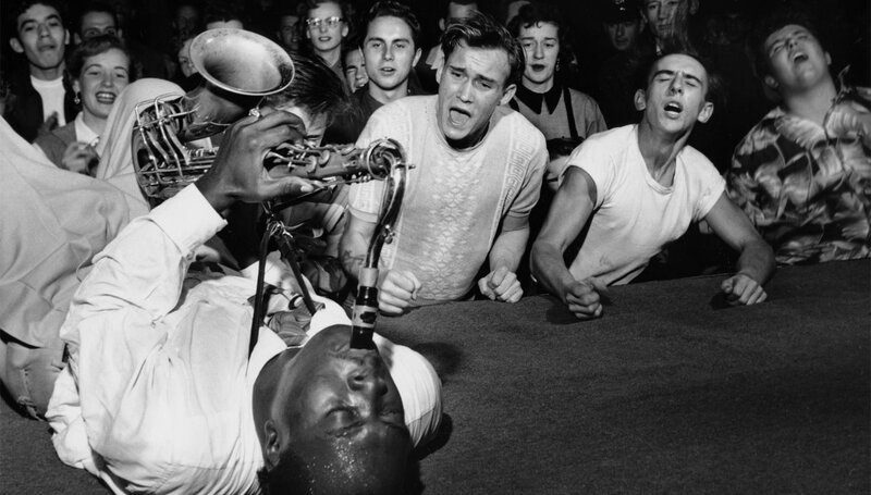 Saxophone player performing on stage