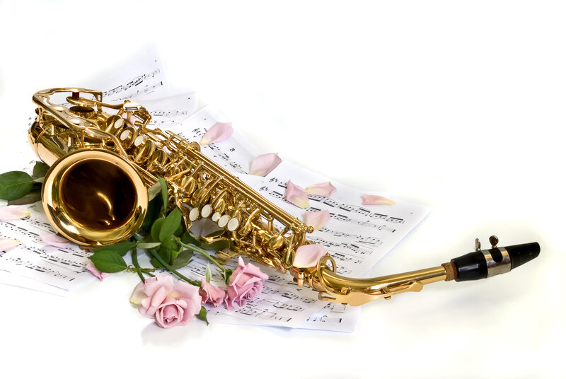 Saxophone with roses and sheet music