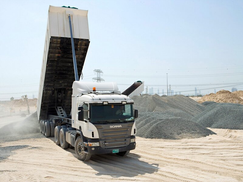 Scania dump truck unloading gravel