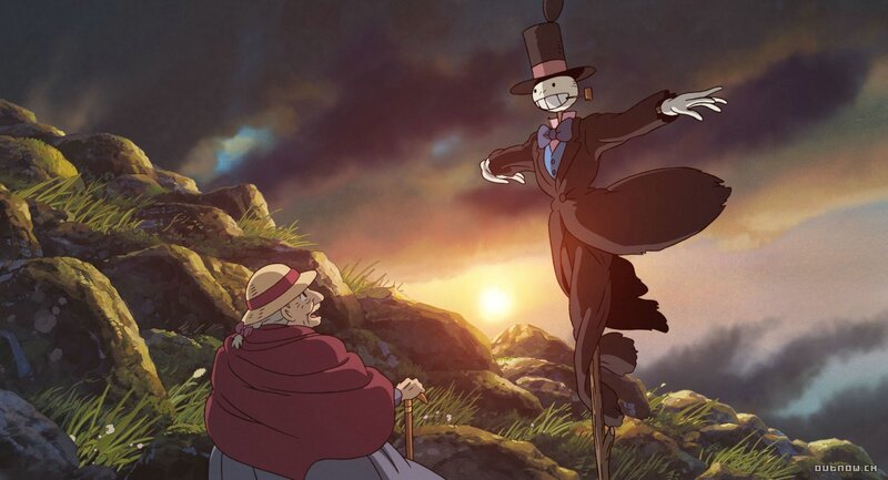 Scarecrow and old woman at sunset