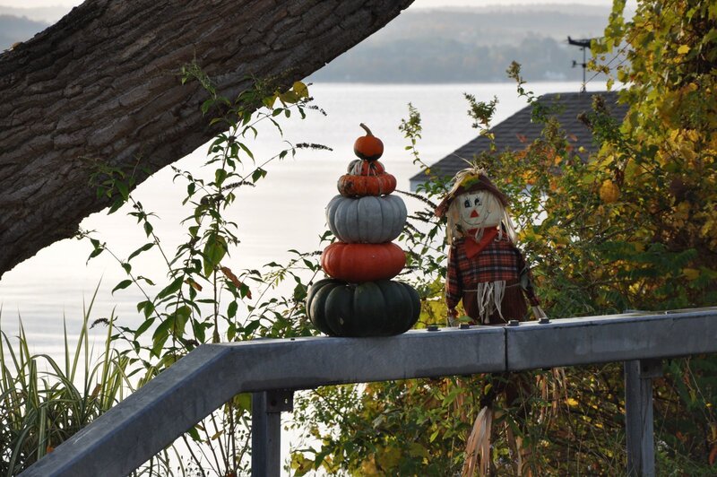 Scarecrow and Stacked Pumpkins