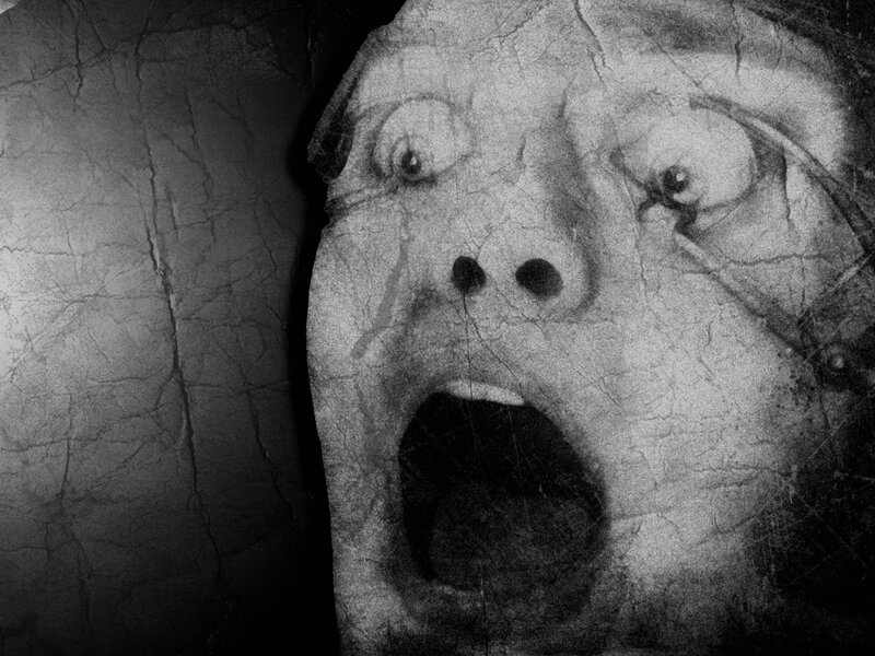 scared face on cracked surface