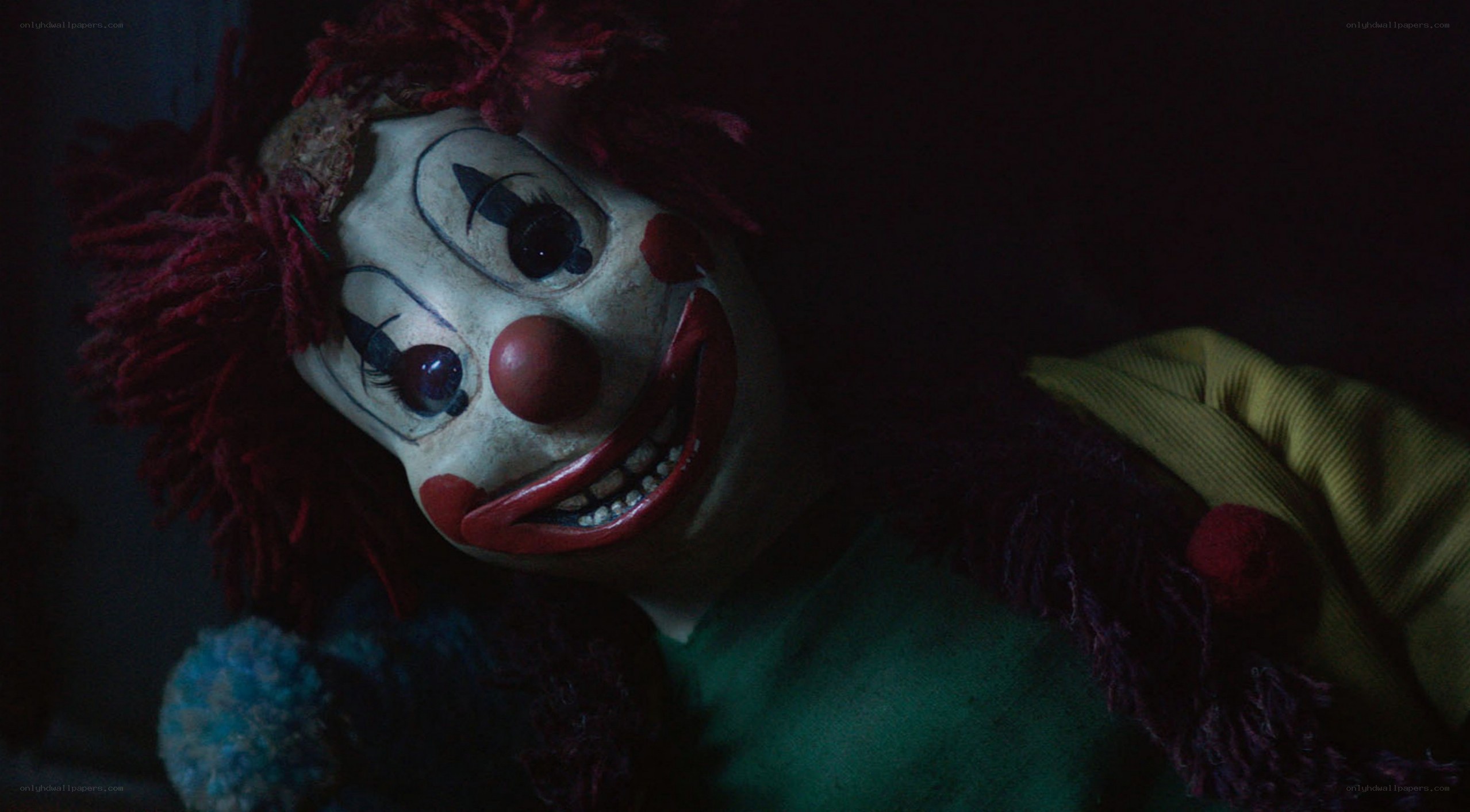 scary clown doll in dark room