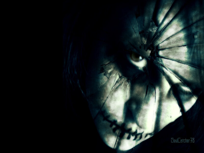 scary face behind cracked glass