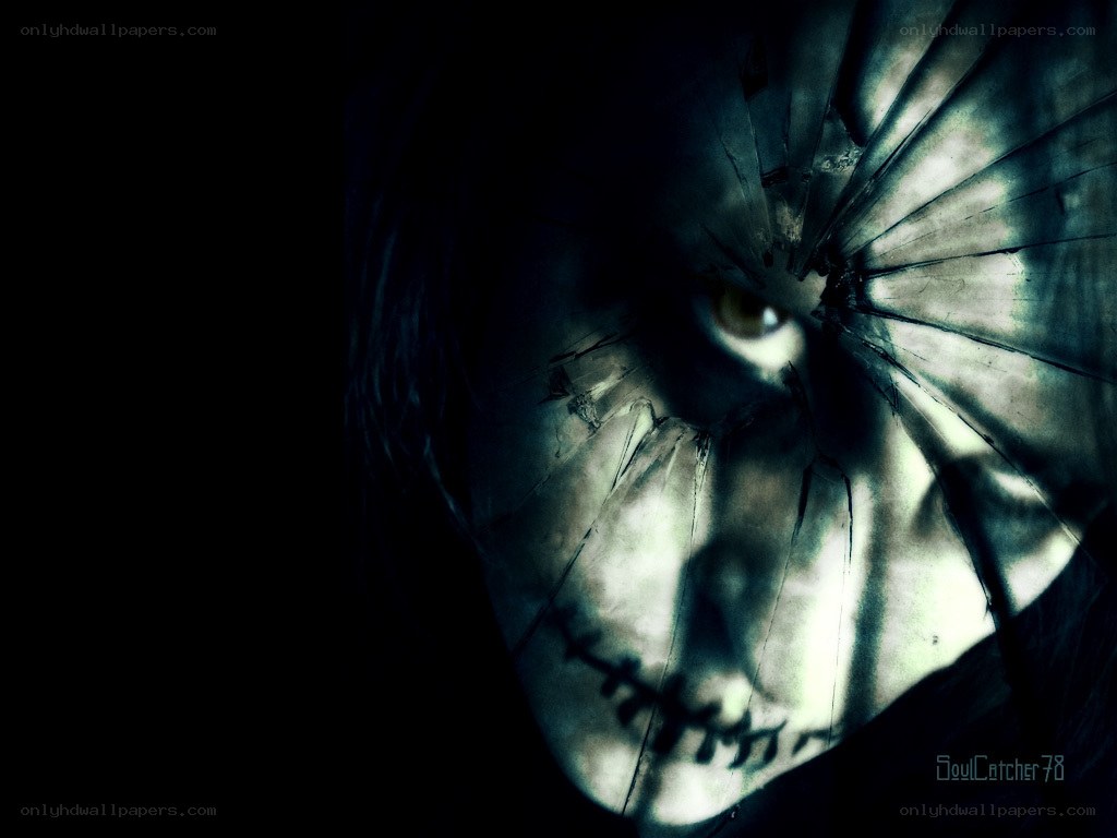 scary face behind cracked glass