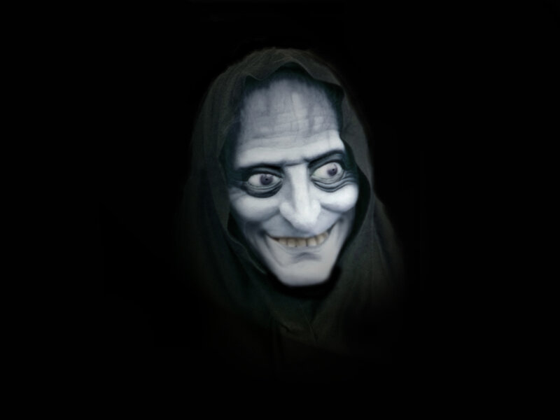 scary face in dark hood