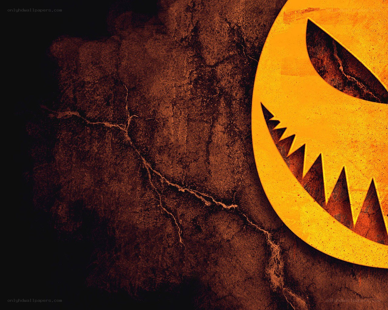 scary pumpkin face on cracked wall