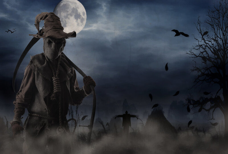 Scary scarecrow in moonlit field