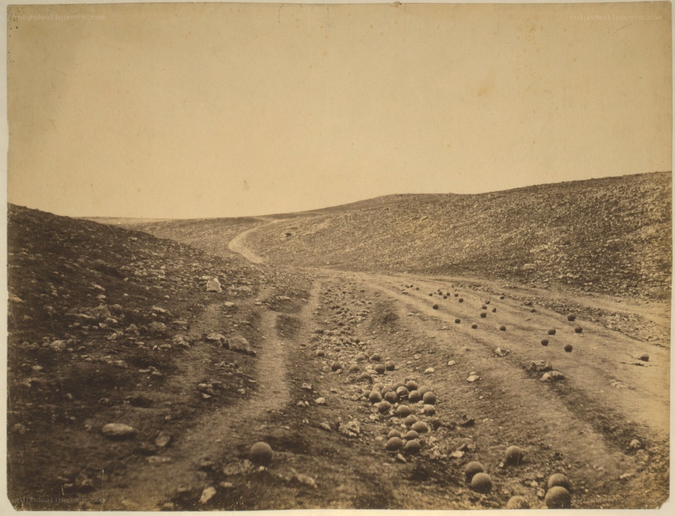 Scattered cannonballs on a hillside
