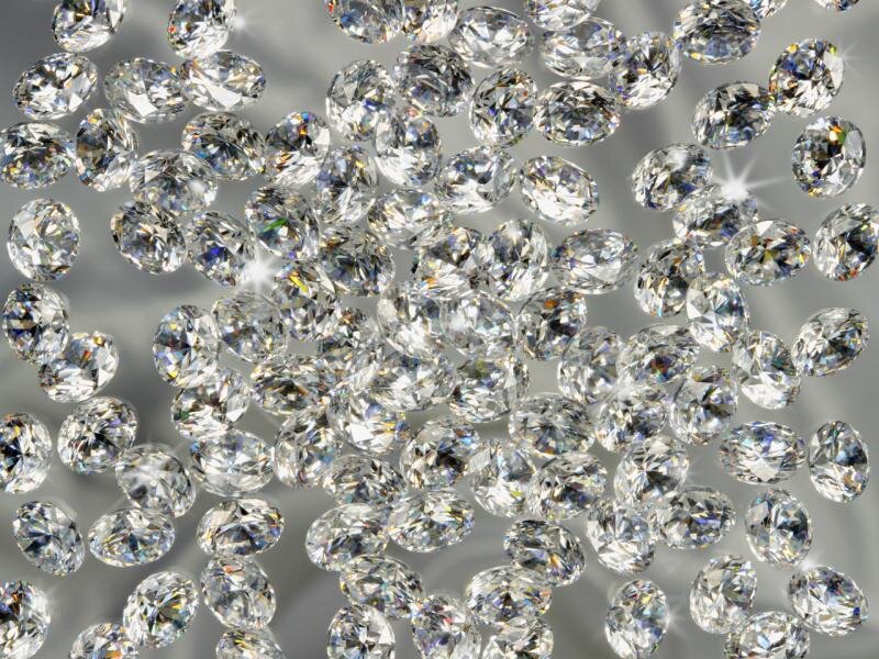 scattered diamonds on reflective surface
