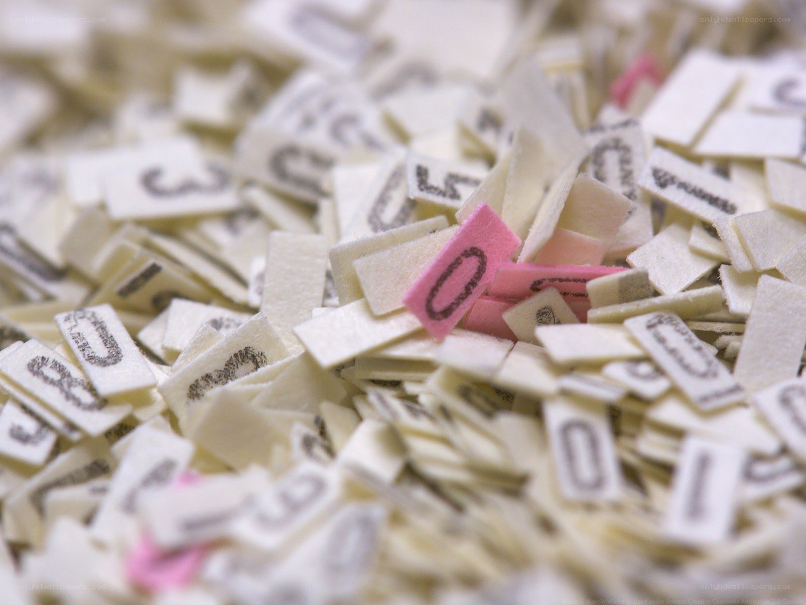 scattered number tiles with pink zero