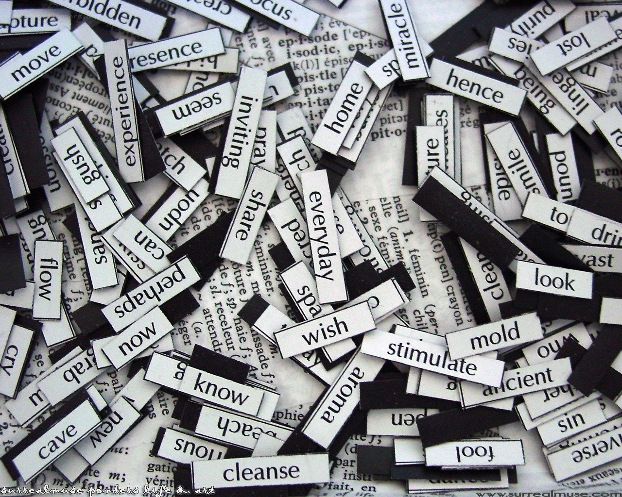 scattered word magnets on a page