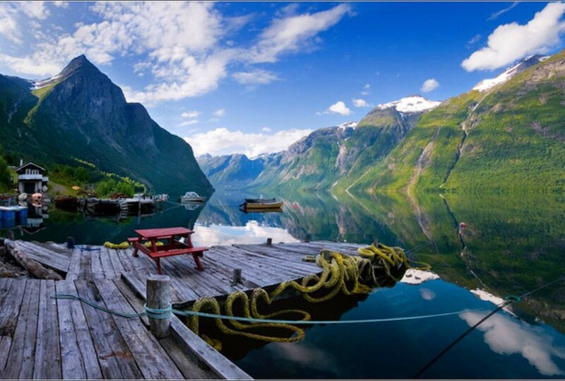 Scenic fjord with wooden dock