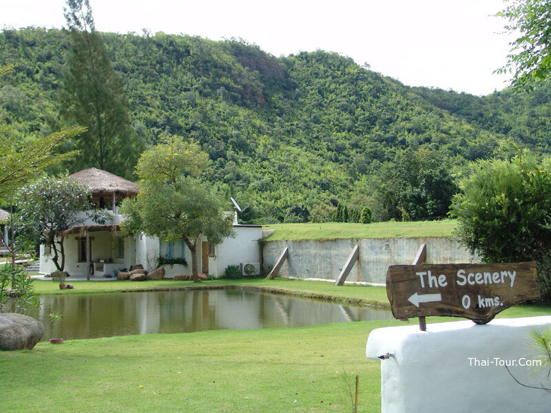Scenic resort with pond and hill