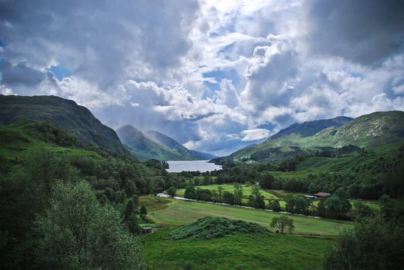 Scenic valley with lake and mountains