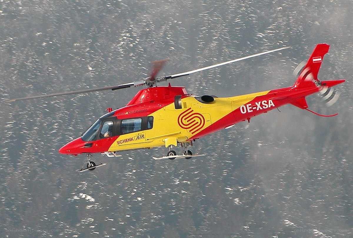 Schenk Air helicopter in flight