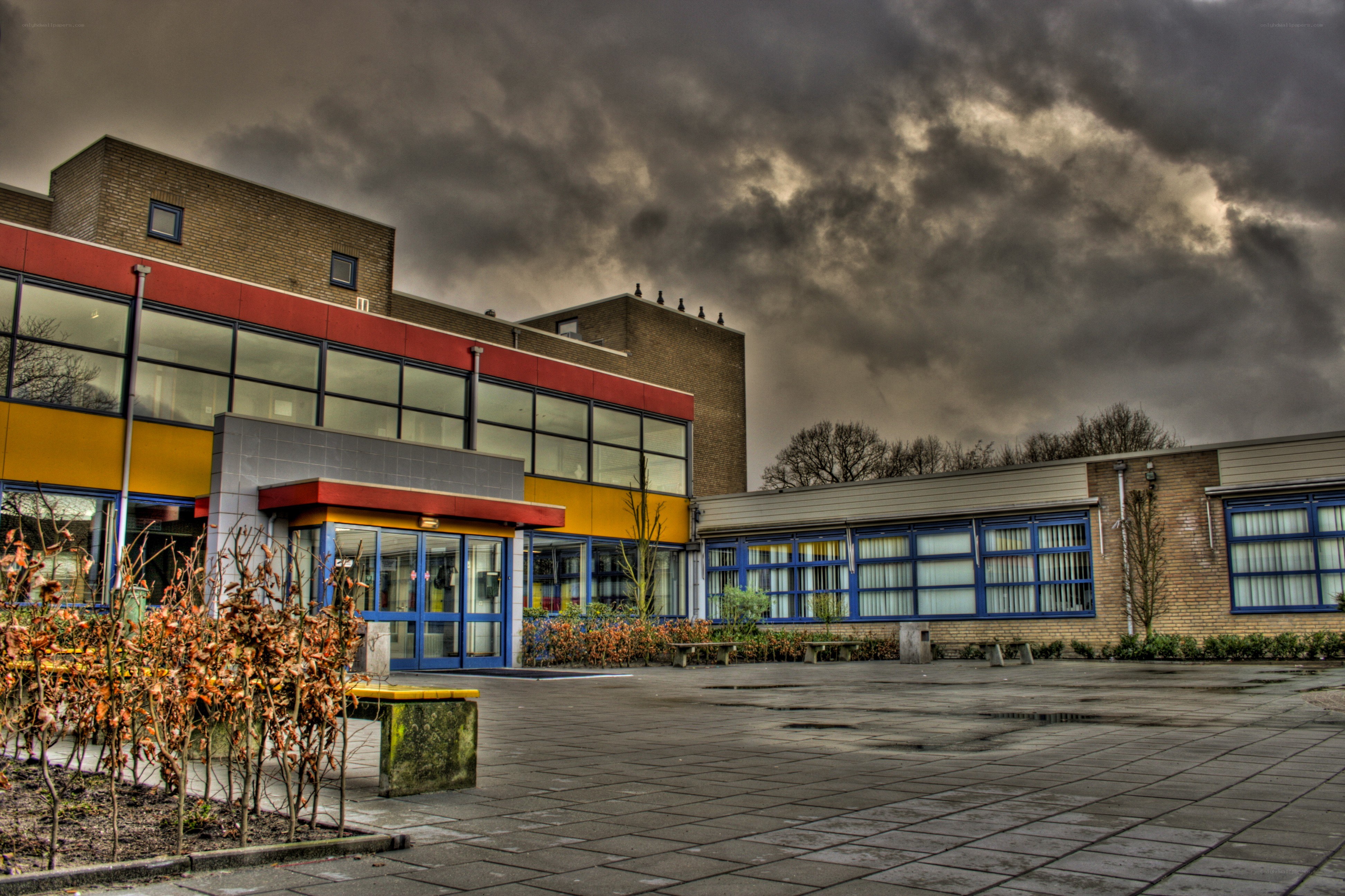 School building under stormy sky